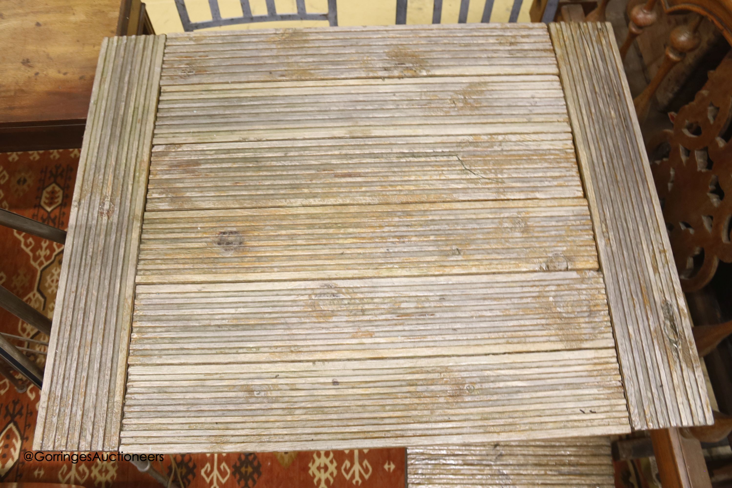 A French slatted wood wrought iron garden table, width 72cm, depth 94cm, height 78cm and four chairs